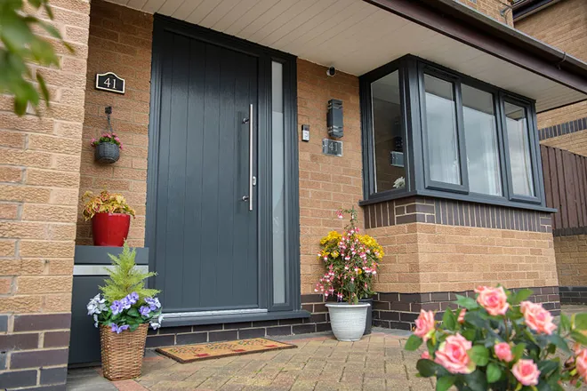 Anthracite grey composite door and uPVC bay window