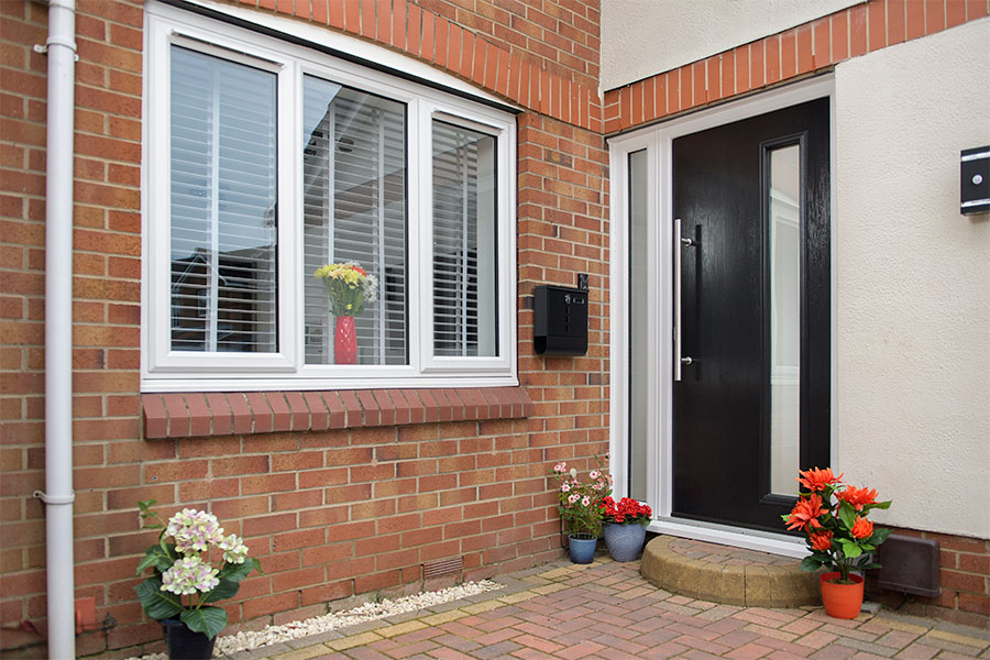 Black Elite Composite Front Door And White Casement Window Safestyle