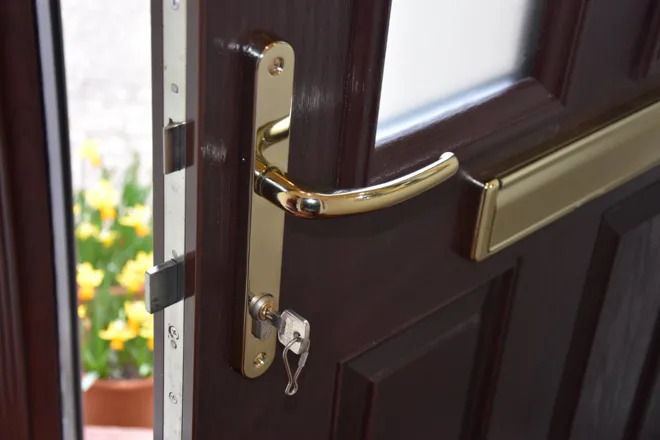 Brown Composite Door Interior Lock And Key Closeup